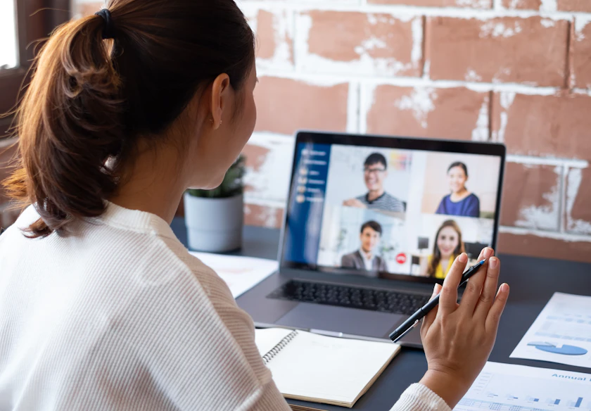 Woman on computer using business fiber internet